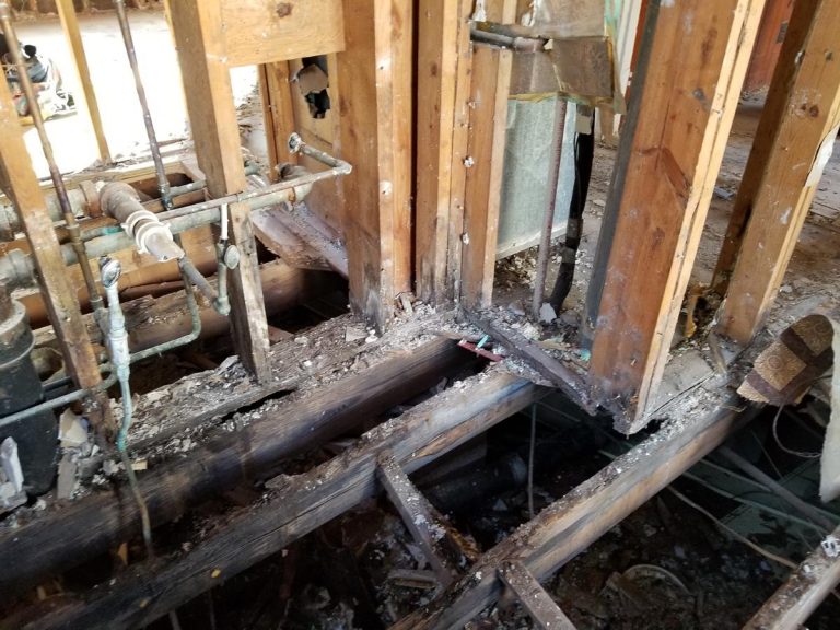 Damaged floor in the kitchen caused by fire