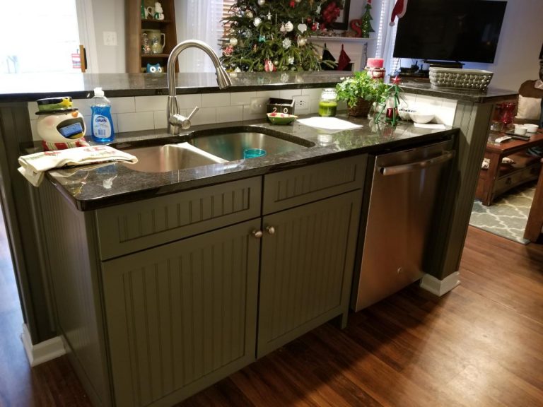 Kitchen sink with granite tiles
