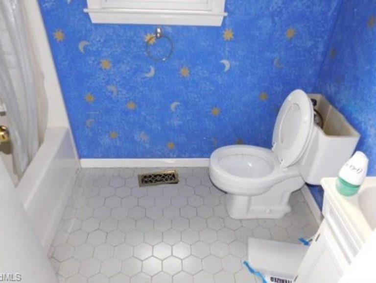 New refurbished bathroom with sun and moon wallpaper