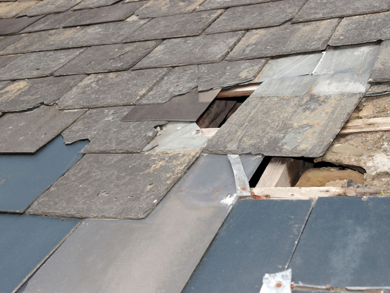 A shattered asphalt roof