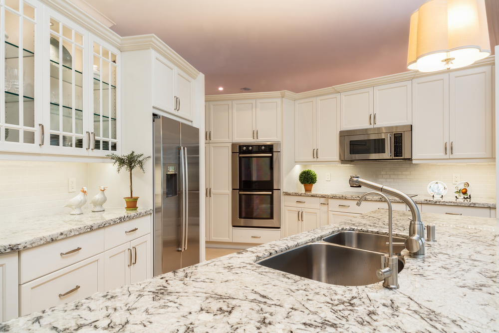 Beautiful home kitchen with white cabinets.