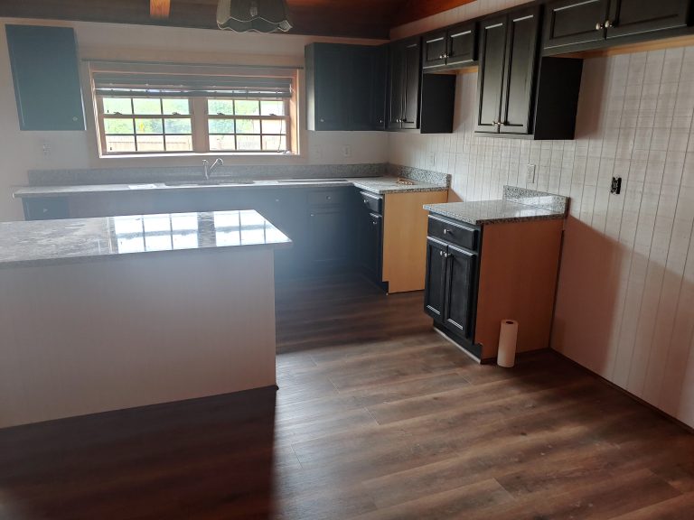 New kitchen and flooring in log cabin home